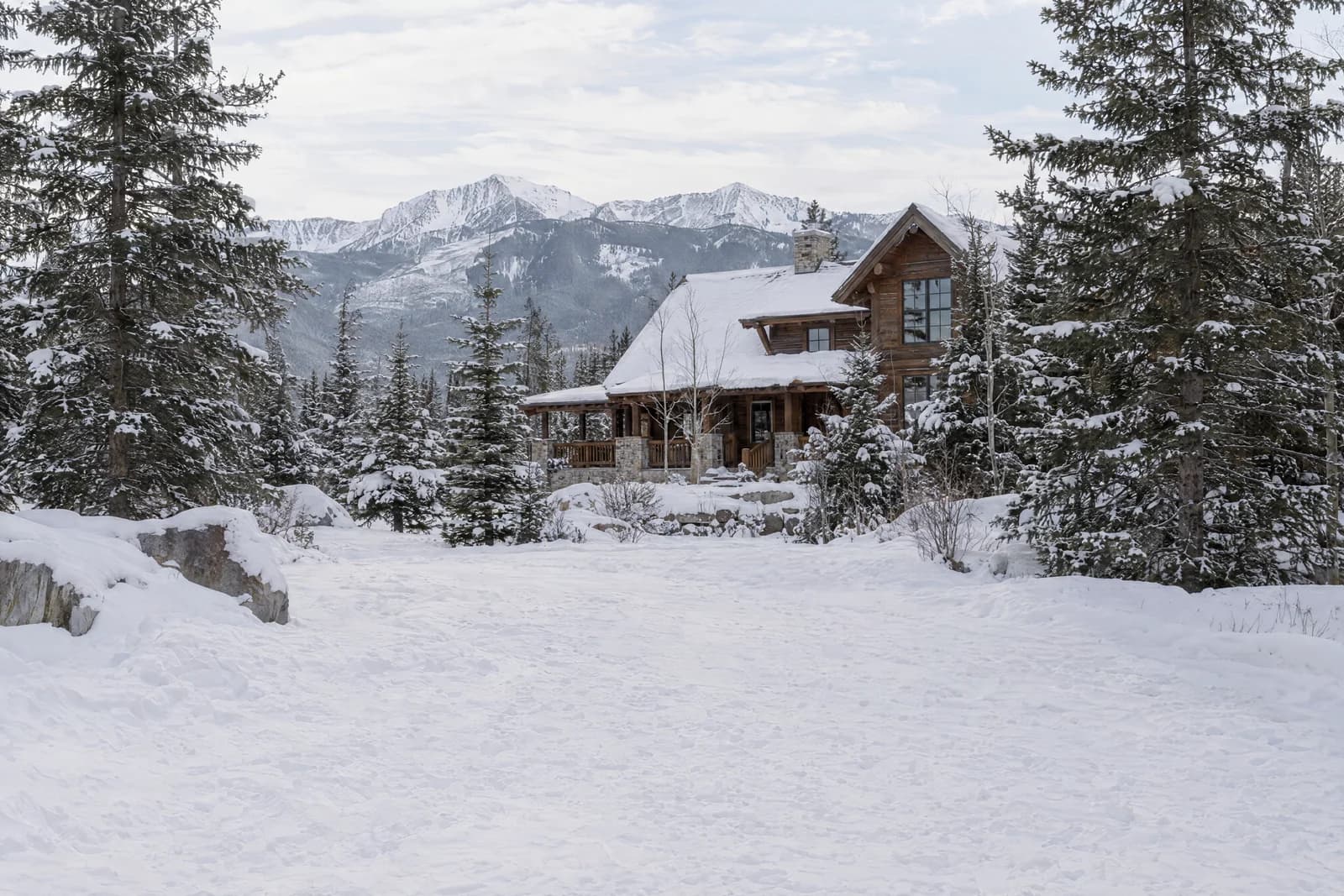 Snowy timber lodge approach — empty photographic background